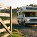 Class C RV heading to a farm location.