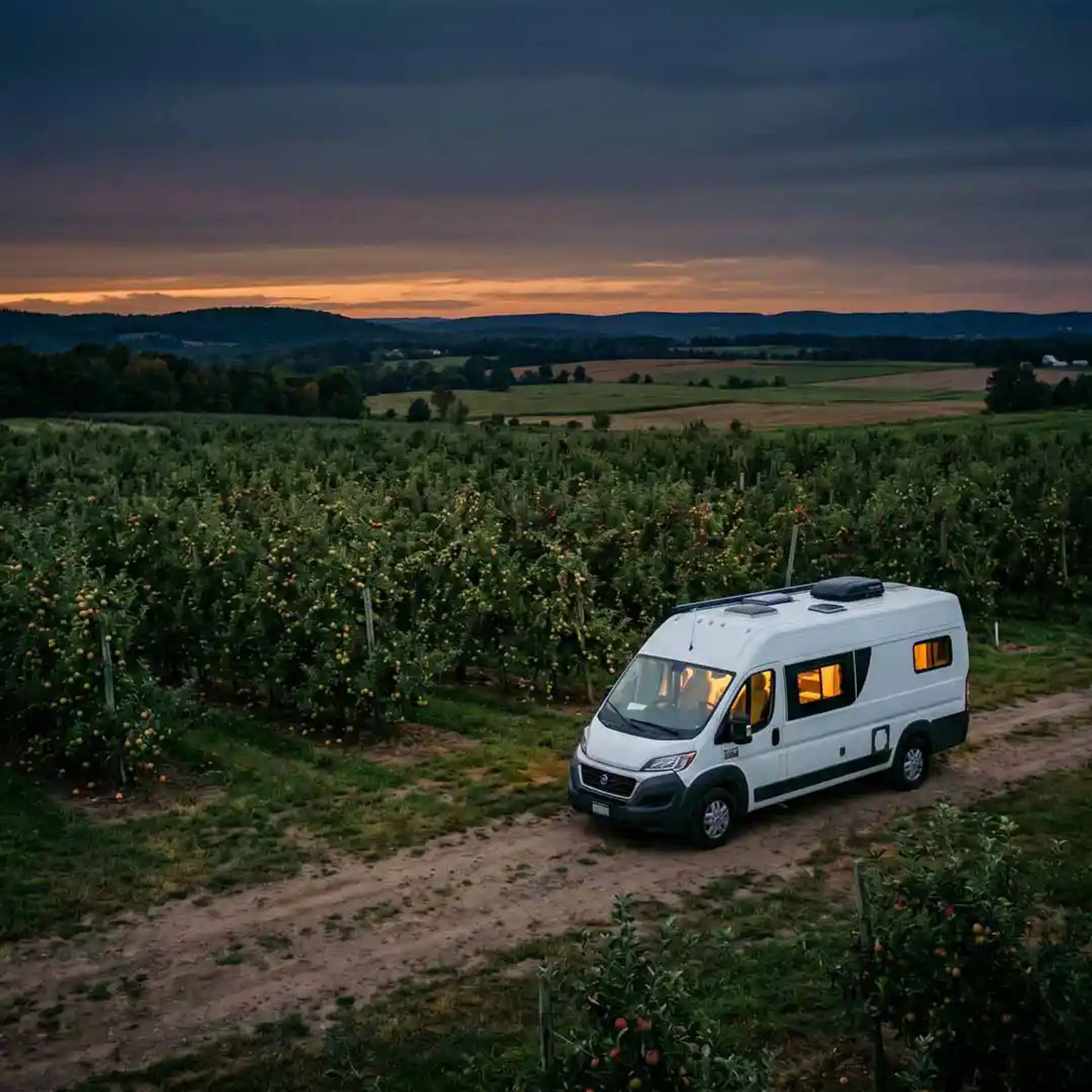Class B parked in an orchard.