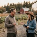 Host and guest talking at a farm.