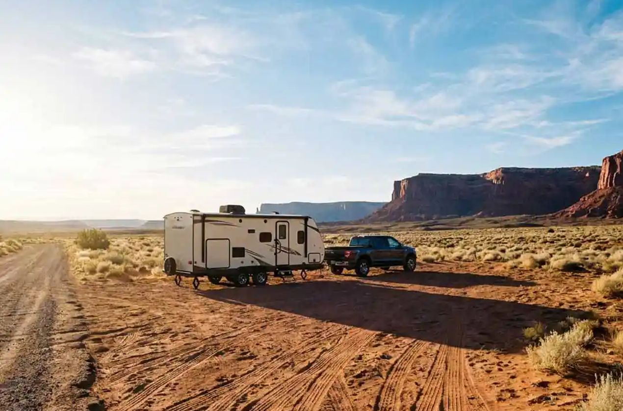Truck pulling travel trailer to go boondocking