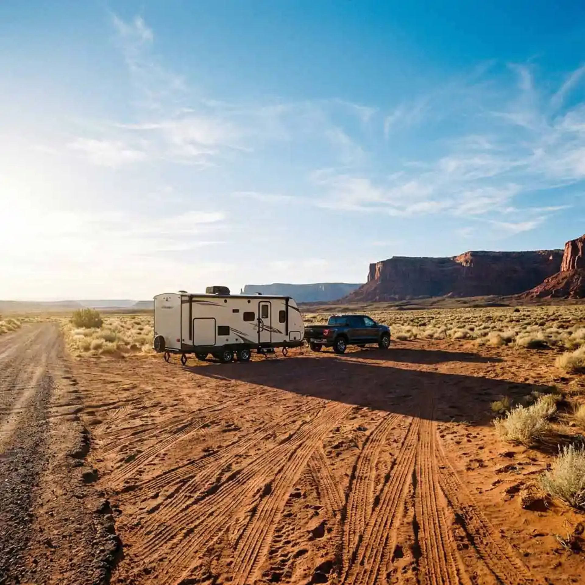 Truck pulling travel trailer to go boondocking