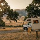 A Class C RV parked near a private site near Yellowstone.