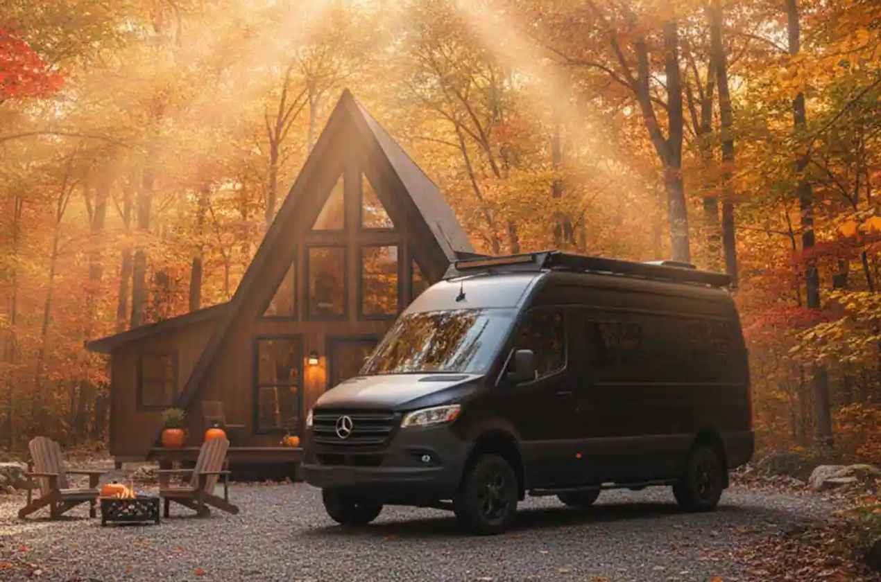 Camper Van by a Cabin